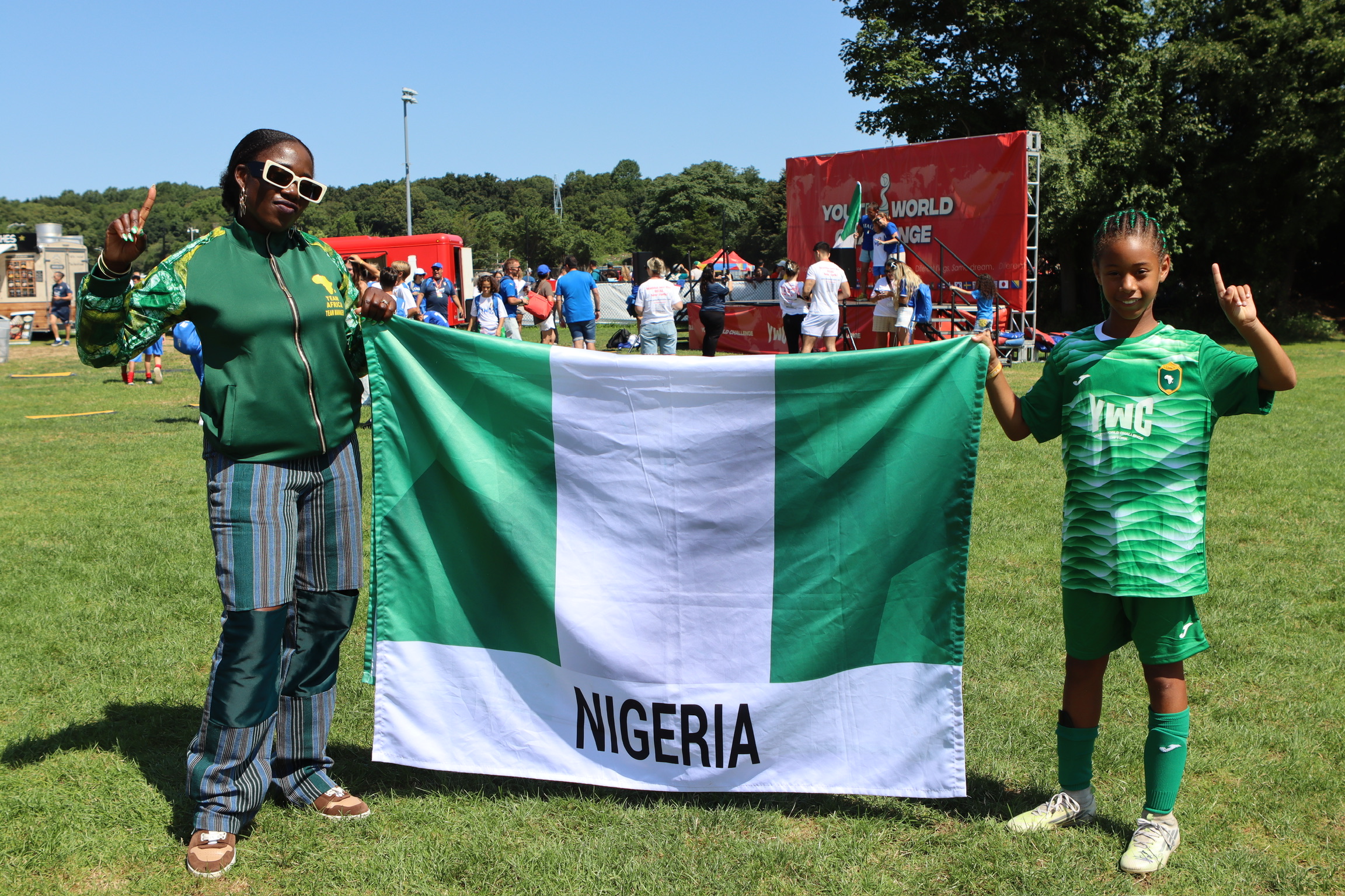 Bisi and Liza with the Nigerian flag at YWC