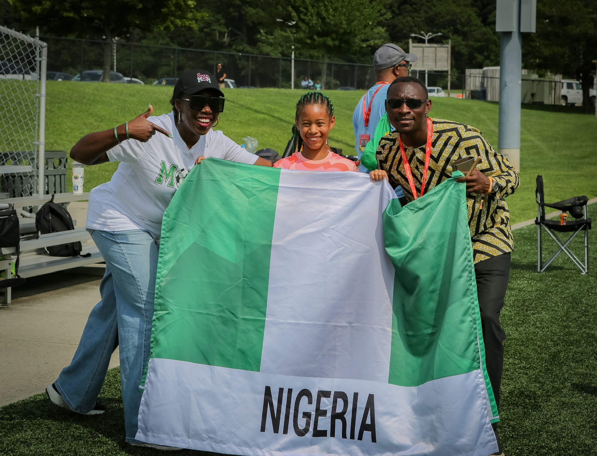 Bisi, Liza and Dr. Ade with the Nigerian flag