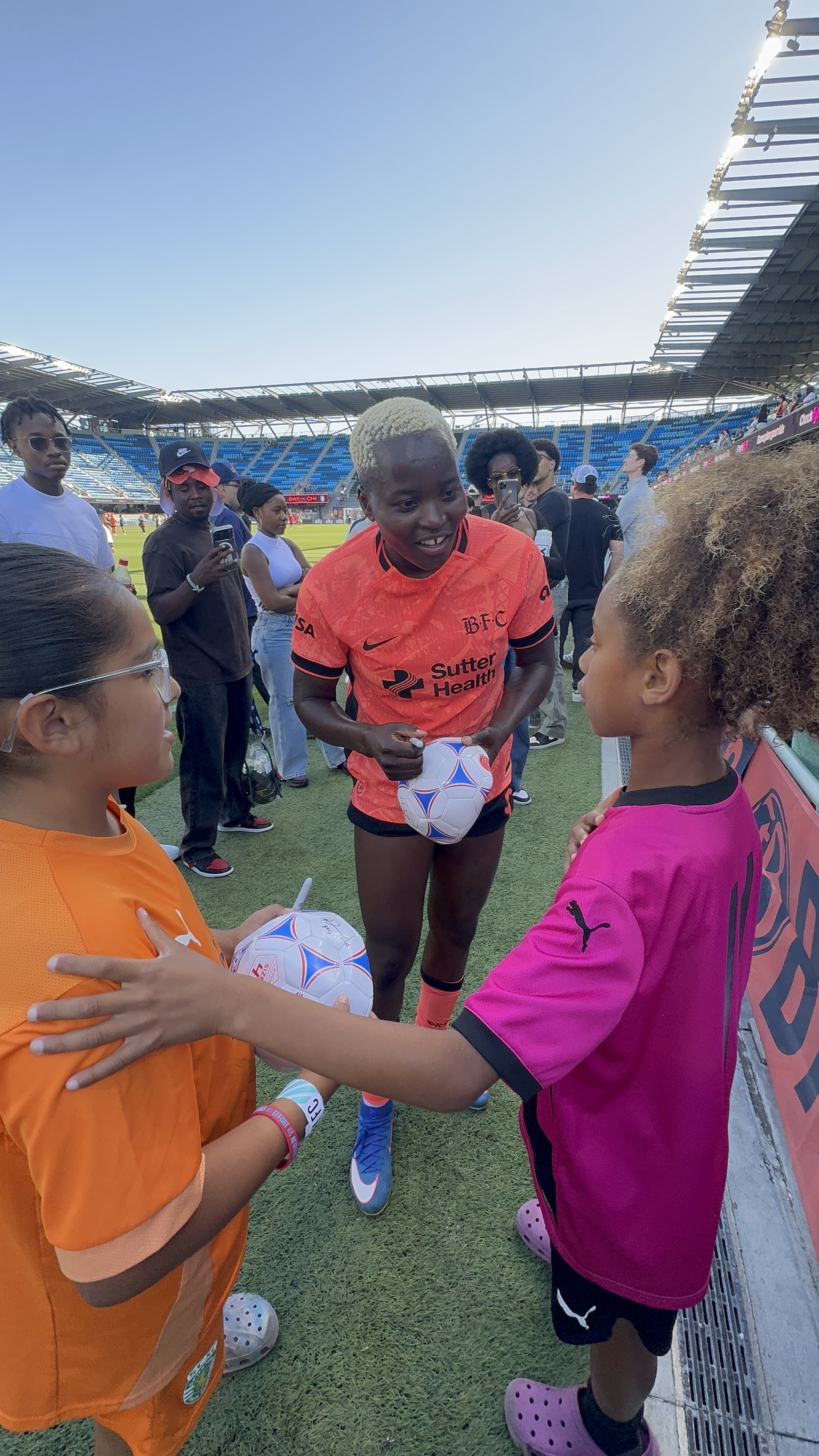 Rachel Kundinaji signing a ball for the girls